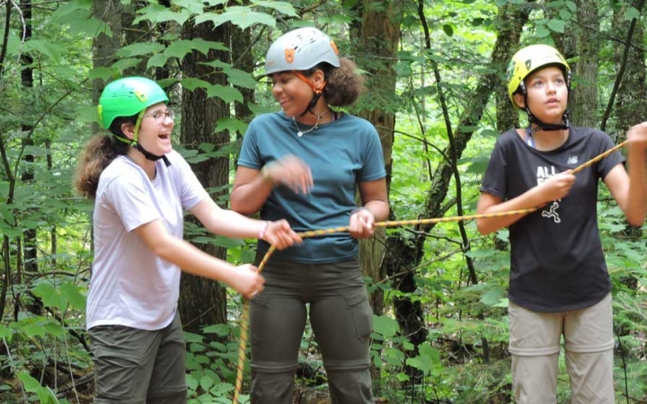 high school girls learn rock climbing skills